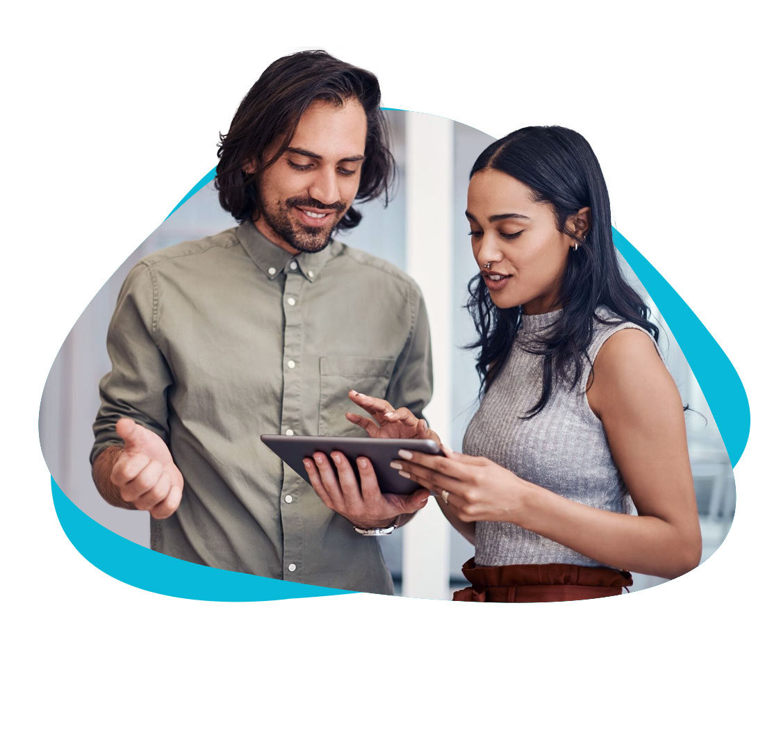 Man and woman reviewing marketing performance data on an iPad.