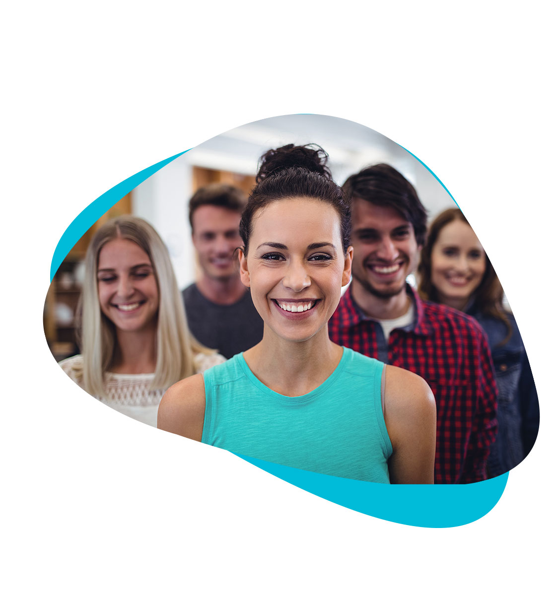 Group of young professionals smiling at the camera.